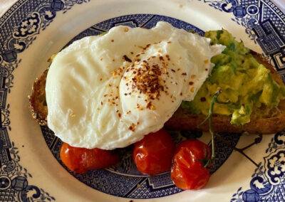Sourdough with avocado, cherry tomatoes and poached egg